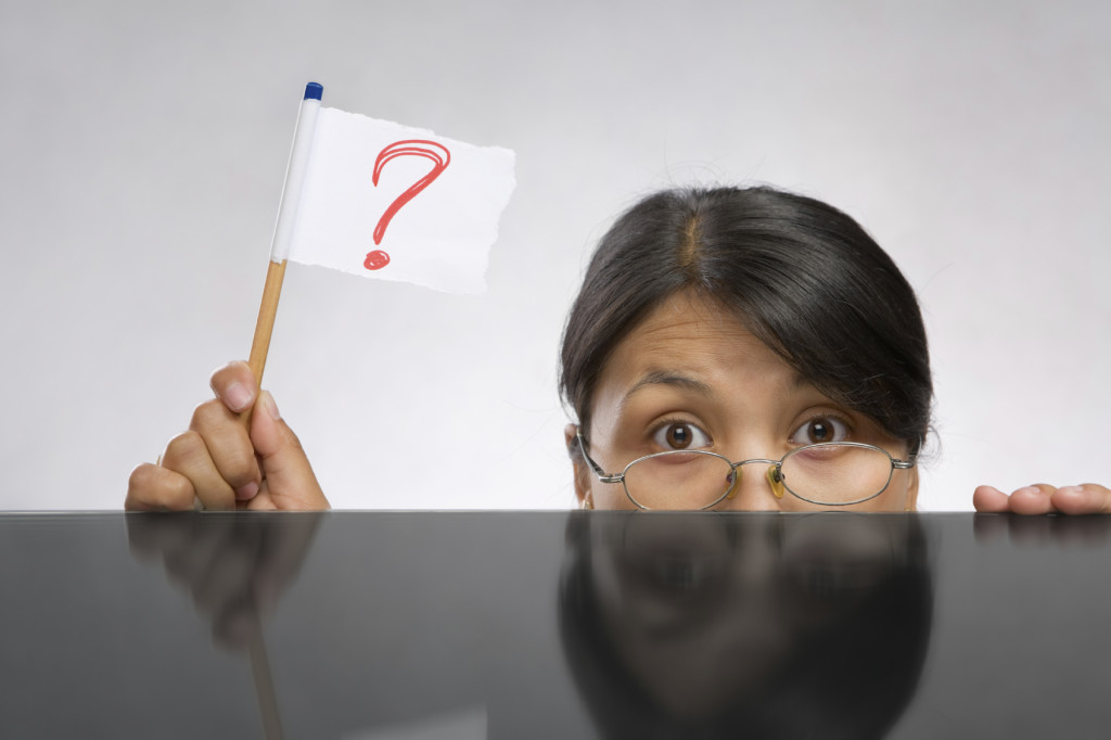 Woman holding question mark flag