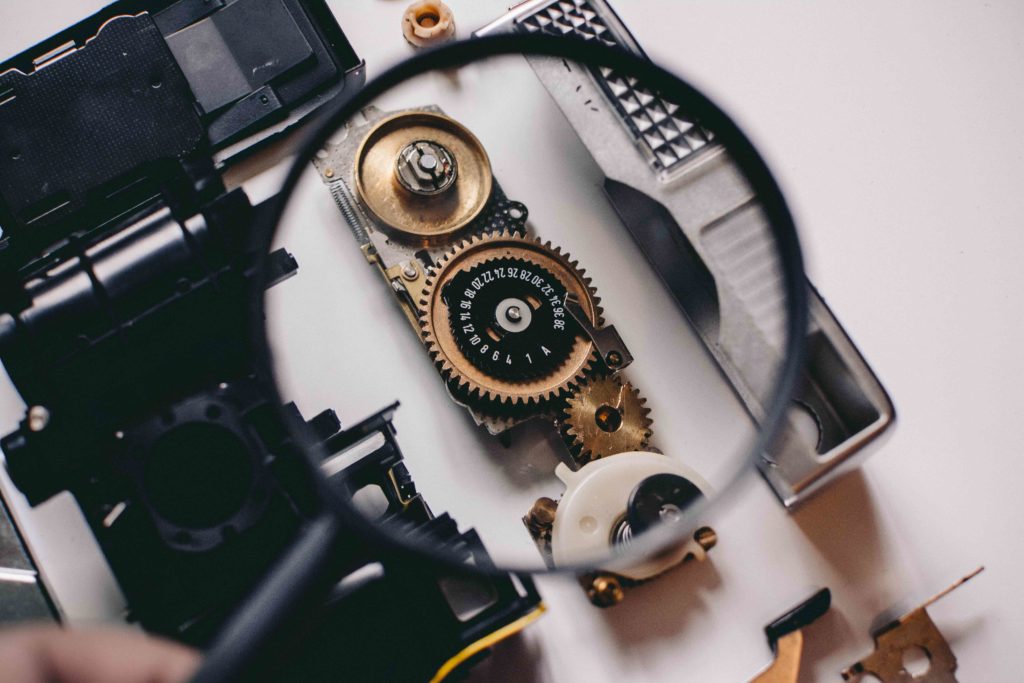 magnifying glass showing camera gears